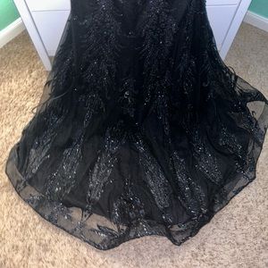 Only worn once  has a tail  open back.